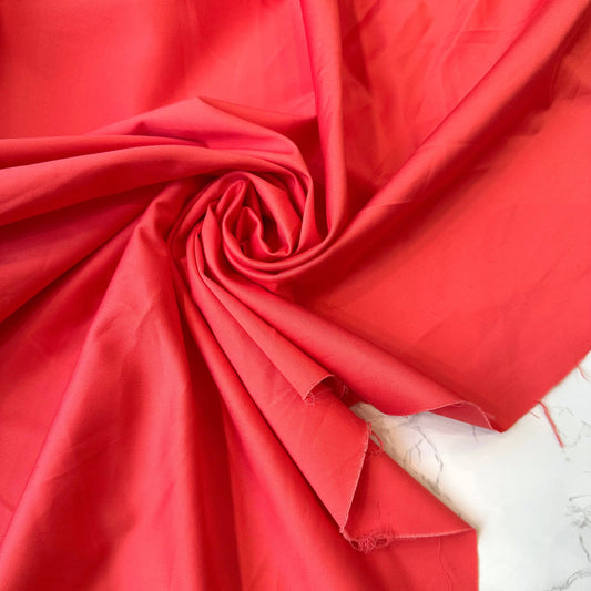 JOSE: Gabardine de coton satiné strech rouge corail