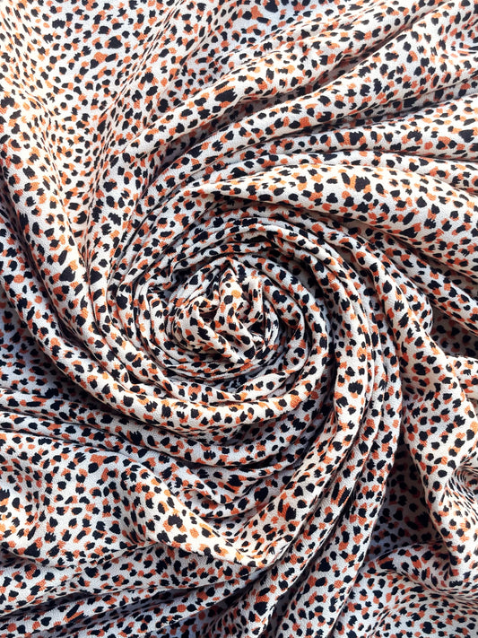 ÉLÉONORE: Crêpe Viscose Imprimé tacheté orange et noir