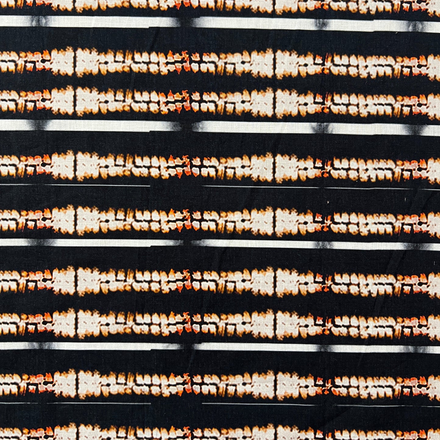 AGLAÉ: cotton poplin printed with Ikat stripes