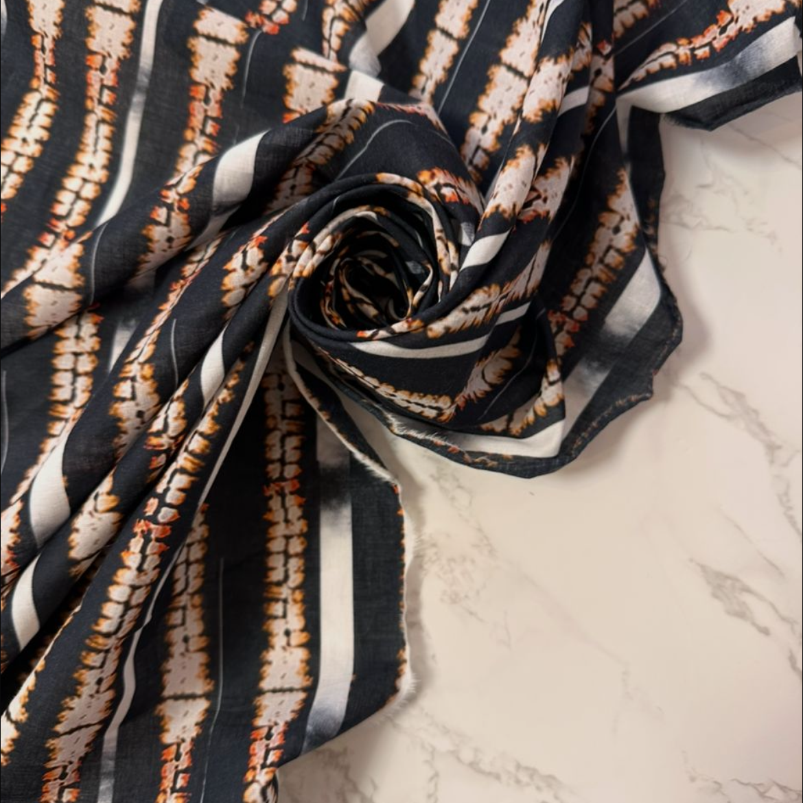 AGLAÉ: cotton poplin printed with Ikat stripes